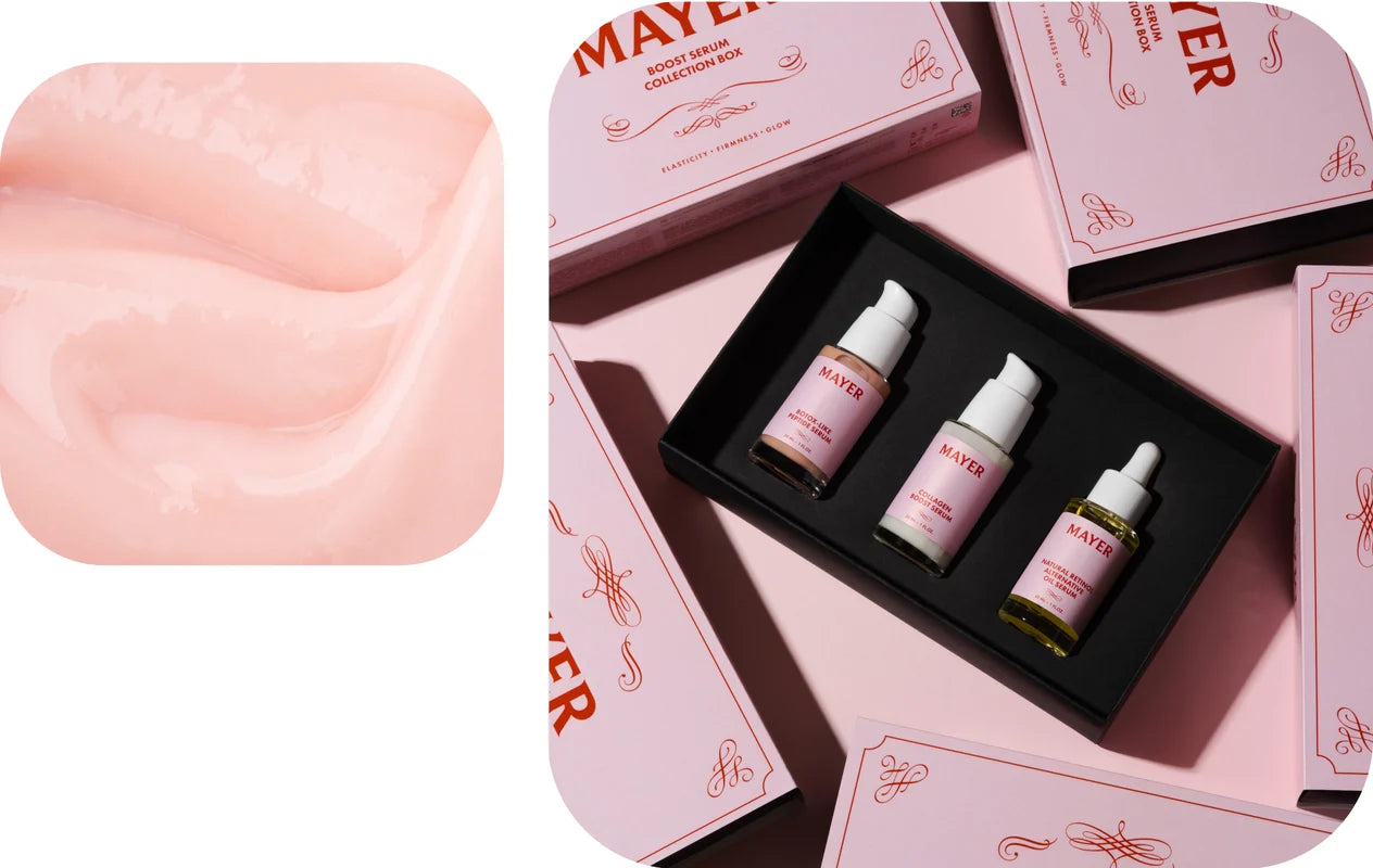 skincare products including bottles and packaging on a pink background