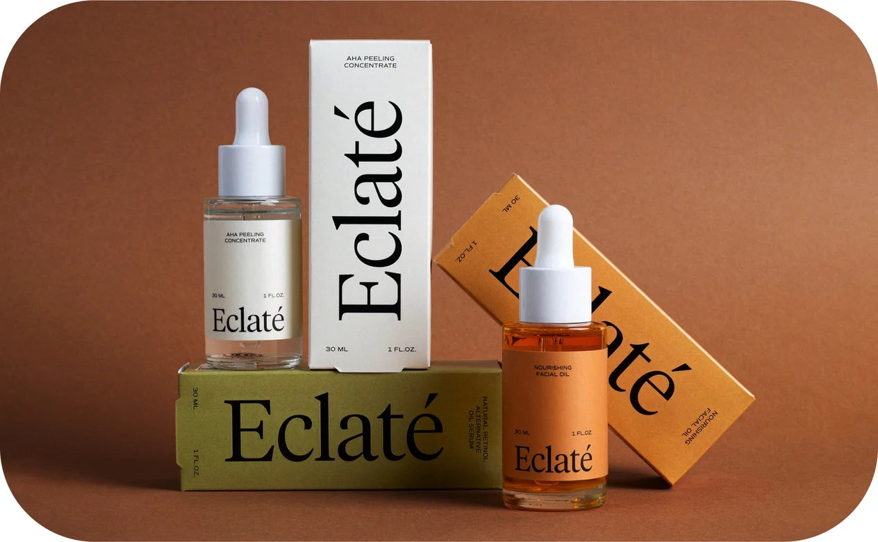 Eclate skincare products including bottles and boxes on a brown background