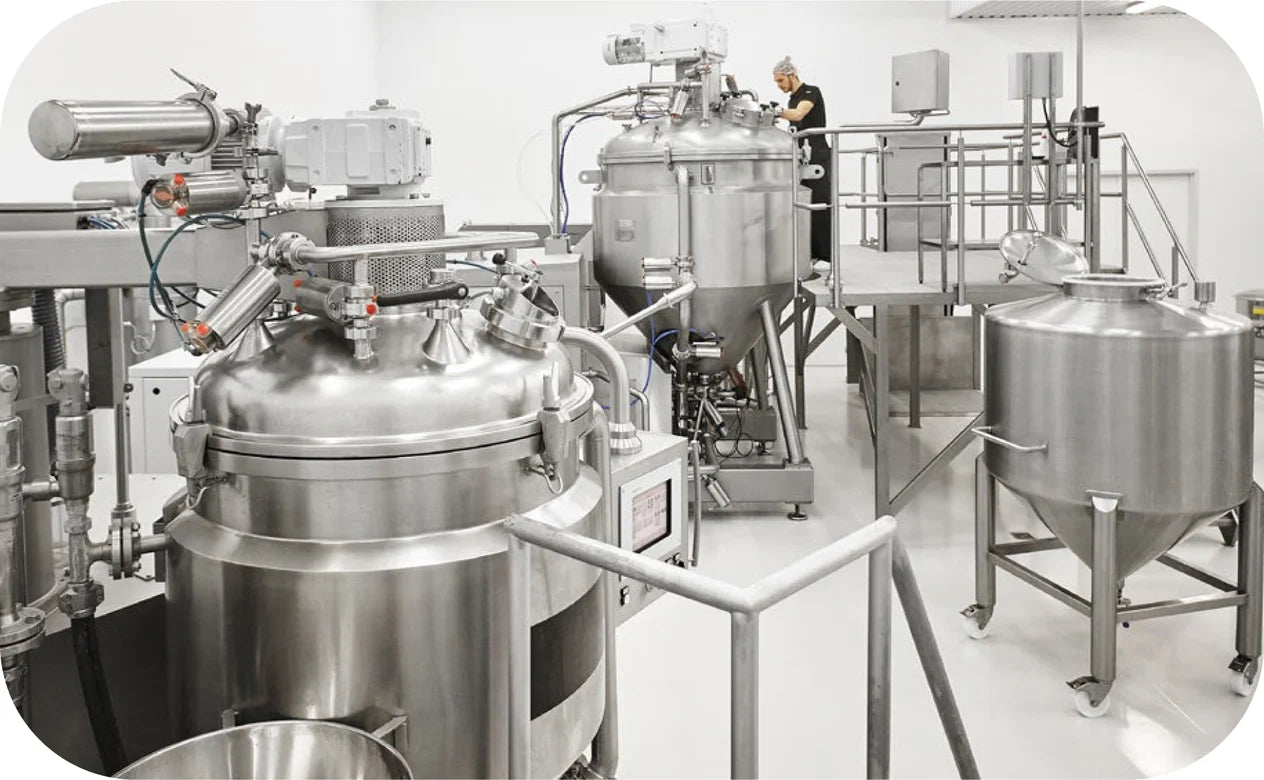 Stainless steel industrial equipment in a factory setting